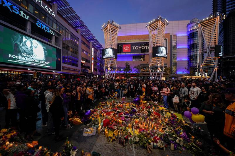 Fans of NBA basketball star Kobe Bryant pay their respects at a memorial outside the Staples Center in Los Angeles, California, on Monday, January 27. Reuters
