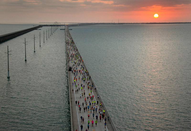 The sun rises above the Florida Keys Overseas Highway as a field of 1,500 runners competes in the Seven Mile Bridge Run, near Marathon, Florida. AFP