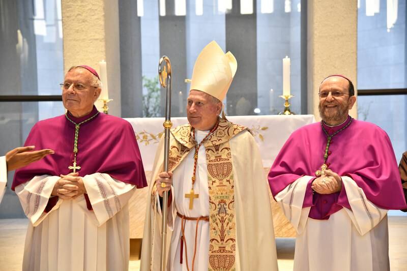 Bishop Paolo Martinelli, right, conducts the first Mass at the church on Sunday within the Abrahamic House in Abu Dhabi with Bishop Paul Hinder, left, and Cardinal Michael Fitzgerald. Photo: Apostolic Vicariate of Southern Arabia