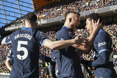 Tottenham's Brennan Johnson, right, celebrates with teammates after scoring his side's opening goal. AP 