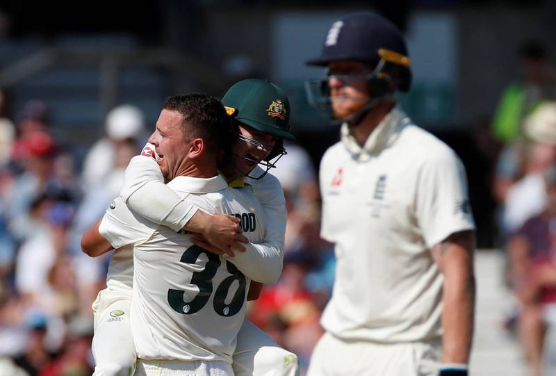 Australia's Josh Hazlewood celebrates taking the wicket of England's Chris Woakes. Reuters