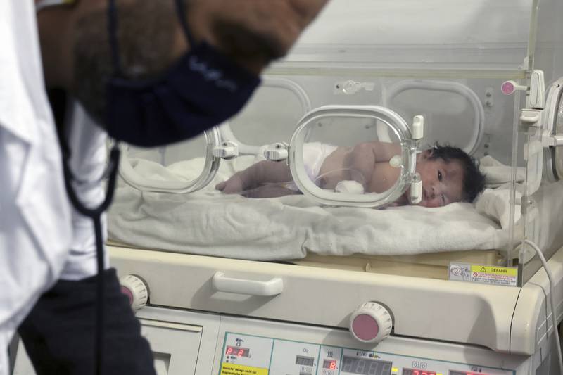 A baby girl born under rubble caused by the earthquake receives treatment at a children's hospital in Afrin, Syria. AP