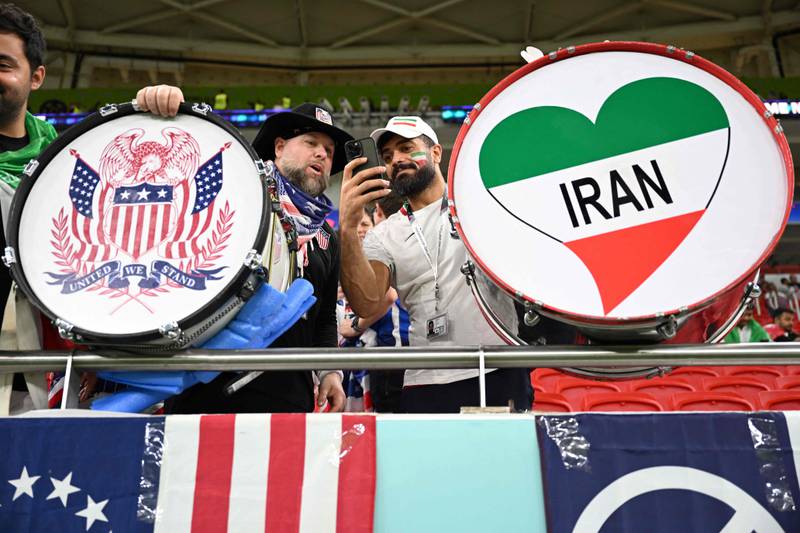 A USA fan meets an Iran fan. AFP