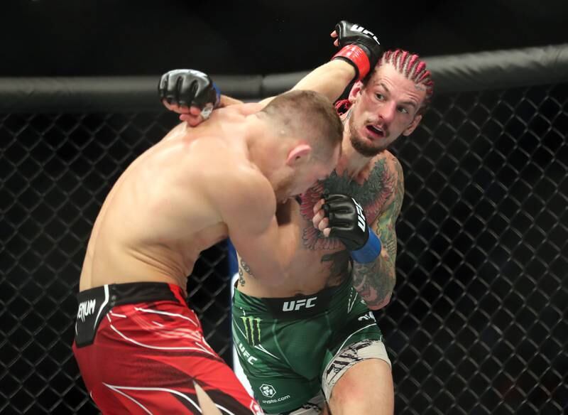 Sean O'Malley, green, defeated Petr Yan in their bantamweight clash at UFC 280 in Abu Dhabi on Saturday night, October 22, 2022. Chris Whiteoak / The National