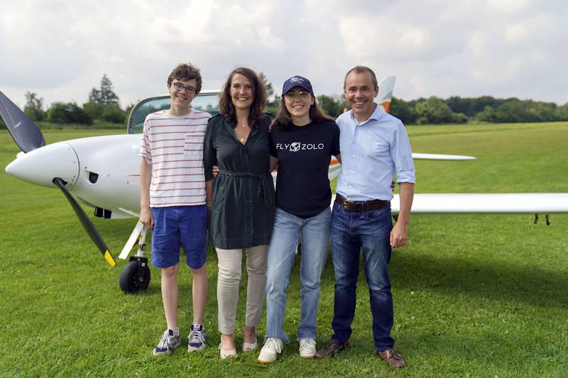 Zara Rutherford (second right) with her family (from left) brother Mack Rutherford, mum Beatrice de Smet and dad Sam Rutherford, alongside a Shark Ultralight aircraft at Popham Airfield in Winchester, Hampshire.