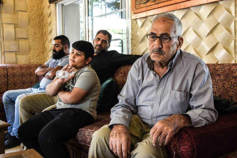 Baalbek, Lebanon, 10 October 2020. Wajih Jaafar, 81, who's grandson is thought to have killed Mohammed Chamas 4 October, sitting with family members at their home in Baalbek. Elizabeth Fitt for The National