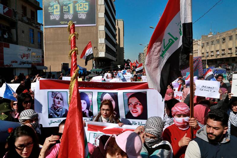 Women hold pictures of female protesters who have been killed in anti-government demonstrations, in Tahrir Square. AP Photo