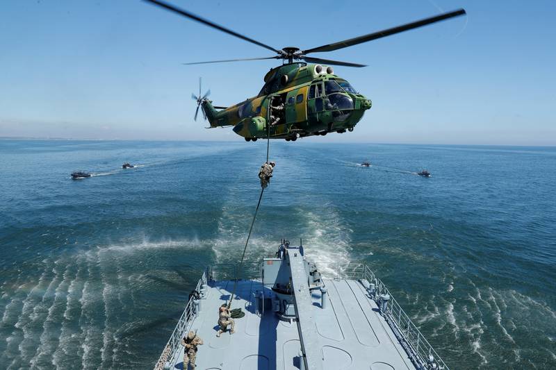 A helicopter carries out a maritime Nato exercise involving Romania, Britain and the US, during a media tour of special operations at sea off Constanta, Romania. Reuters