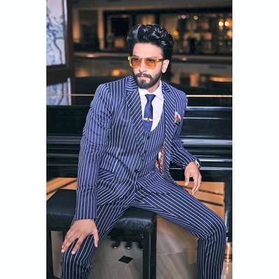 Suave pinstripes and debonair accessories were the look of the day on March 12, 2019. Instagram / Ranveer Singh