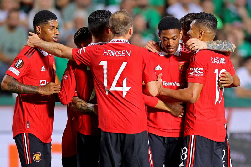 Manchester United's Anthony Martial is congratulated by teammates after scoring in the 3-2 Europa League win against Omonia Nicosia on October 6, 2022. AFP