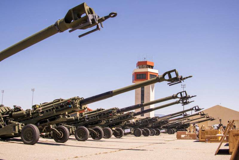 American 155 mm howitzers due to be being loaded on to a US Air Force plane to Ukraine. AFP