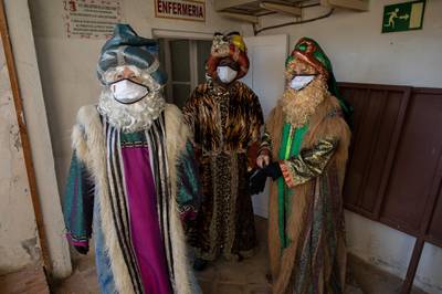 ‘Tres Reyes Magos’ prepare to meet children at Aranjuez's bullring in Spain. The traditional Three Wise Men parades have been cancelled or modified this year across Spain. Getty Images