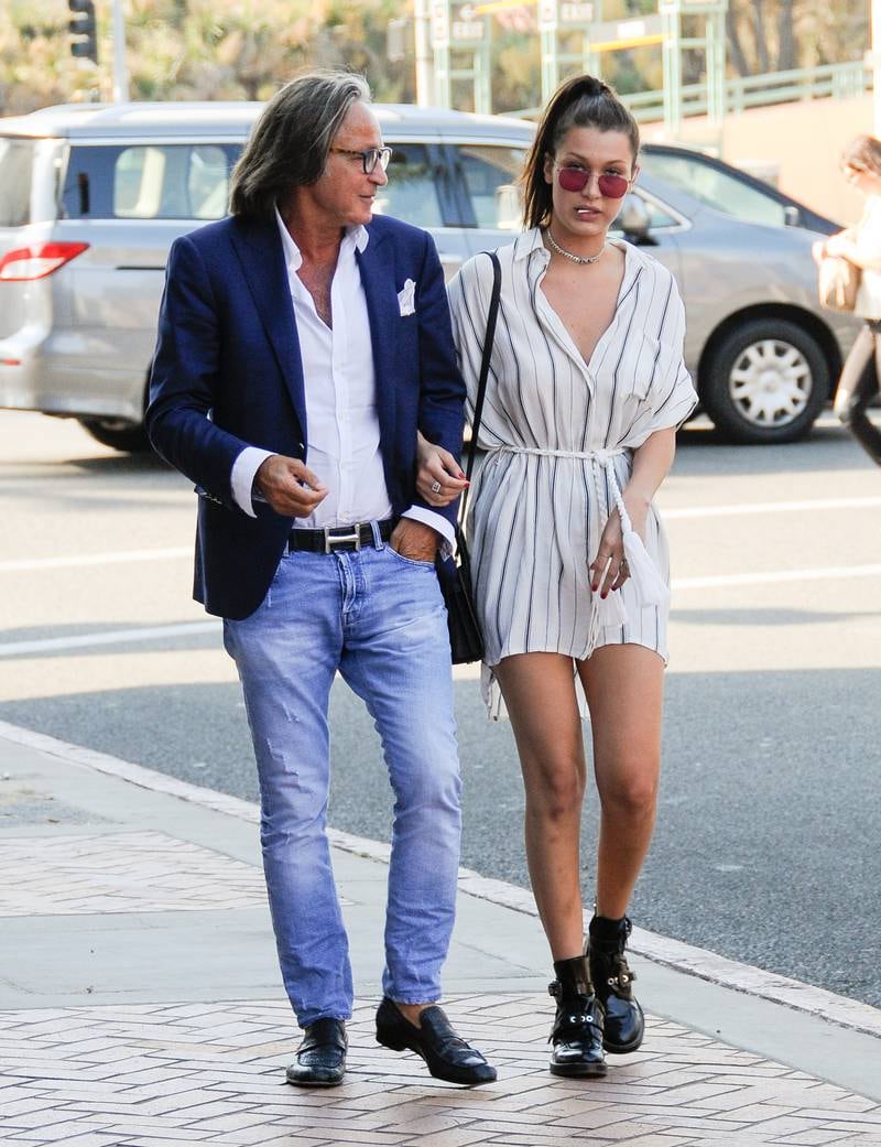 Bella Hadid with her father, Mohamed. Her admission about her nose surgery at aged 14 has started conversations about plastic surgery for teenagers. GC Images