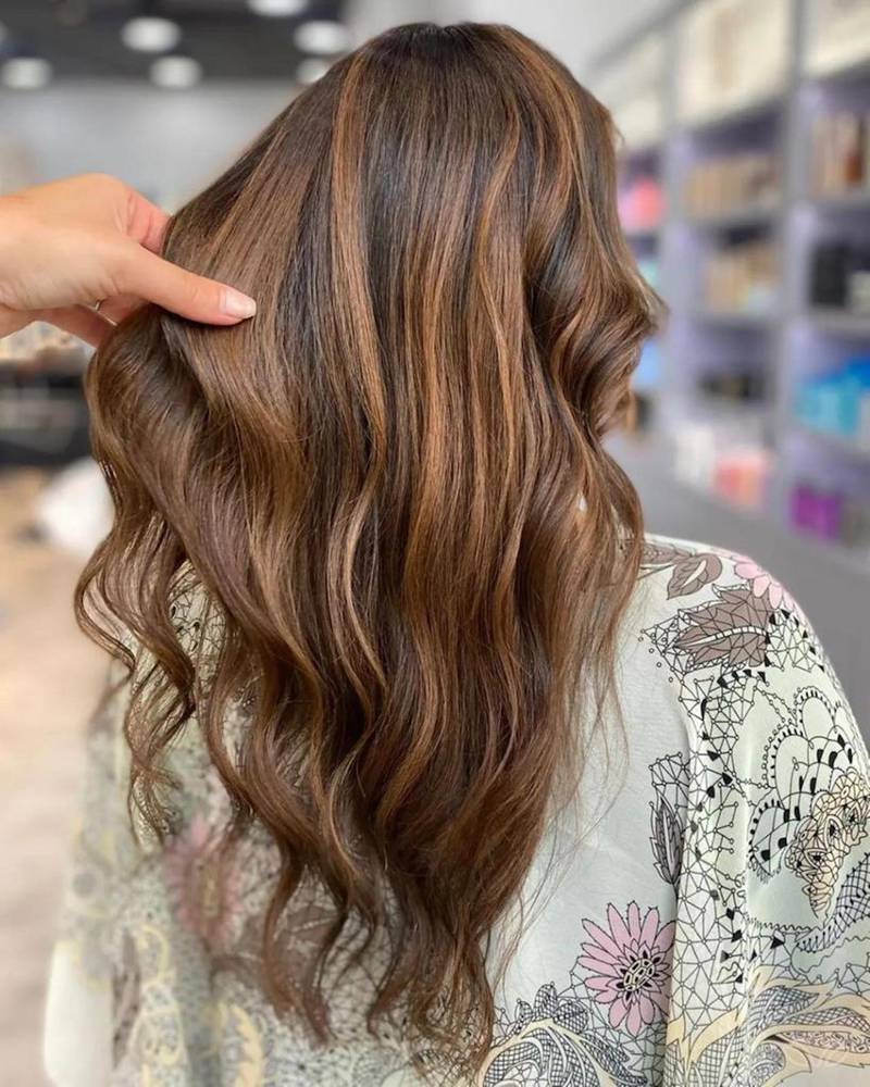 For balayage styles, dark brunette roots can melt into notes of caramel and cinnamon. Photo: Tara Rose Salon
