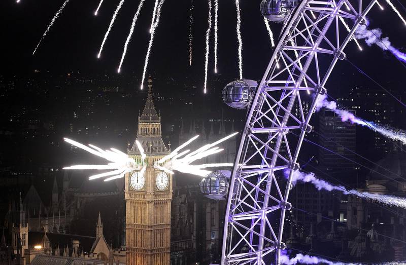 LONDON, ENGLAND - JANUARY 01:  Fireworks light up the London skyline and Big Ben just after midnight on January 1, 2012 in London, England. Thousands of people lined the banks of the River Thames in central London to see in the New Year with a spectacular fireworks display.  (Photo by Peter Macdiarmid/Getty Images)