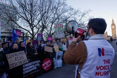 Striking nurses on a picket line outside St. Thomas' Hospital in London. Bloomberg