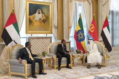 ABU DHABI, UNITED ARAB EMIRATES - July 24, 2018: HH Sheikh Mohamed bin Zayed Al Nahyan Crown Prince of Abu Dhabi Deputy Supreme Commander of the UAE Armed Forces (R), meets with HE Dr Abiy Ahmed, Prime Minister of Ethiopia (L) and HE Isaias Afwerki, President of Eritrea (C), during a reception at the Presidential Palace. 

( Mohamed Al Hammadi / Crown Prince Court - Abu Dhabi )
---