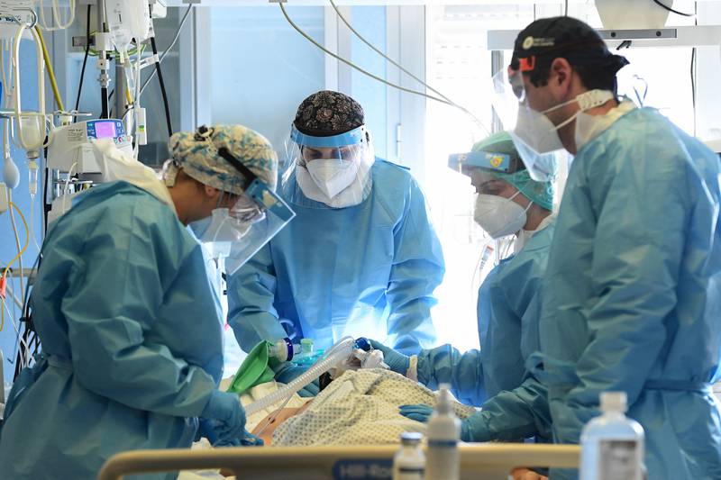 Medics tend to a Covid-19 patient at the intensive care unit of Cremona Hospital in northern Italy. AFP