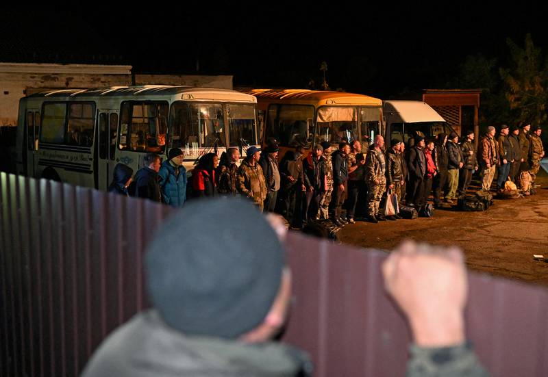 Russian reservists drafted during the partial mobilisation line up outside a recruitment office in the Siberian town of Tara in the Omsk region. Reuters