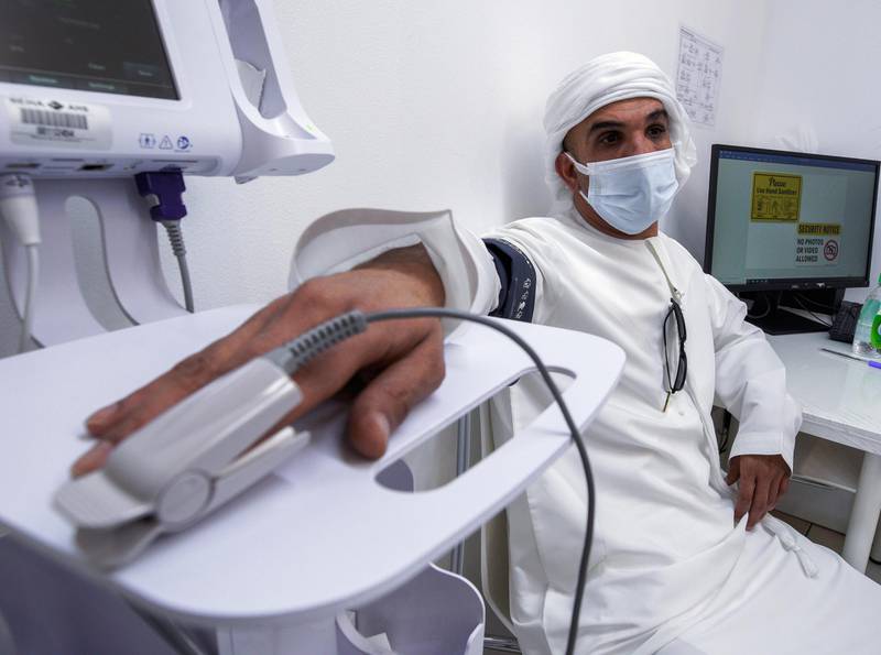 Abu Dhabi, United Arab Emirates, January 12, 2021. SEHA Vaccination Centre at the Abu Dhabi Cruise Terminal area.  Abdulaziz Karmastaji gets vaccinated.
Victor Besa/The National
Section:  NA
Reporter:  Shireena Al Nowais