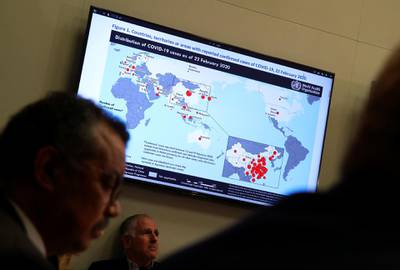 A map showing the distribution of coronavirus (COVID-2019) cases all around the world is displayed on a TV during a World Health Organization (WHO) news conference in Geneva, Switzerland. Reuters