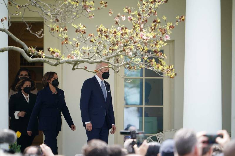 Mr Biden with Deputy Attorney General Lisa Monaco and Vice President Kamala Harris in the Rose Garden of the White House.  AFP