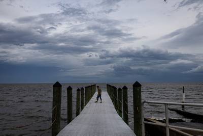 A man walks onto a dock ahead of Hurricane Idalia in Florida. Bloomberg