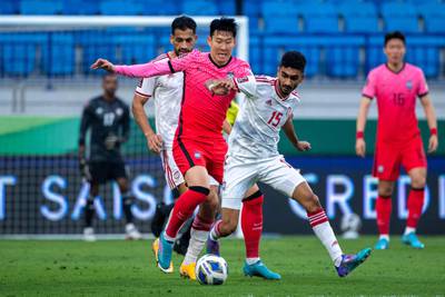 UAE's Mohammed Al Baloushi battles for the ball with South Korea forward Son Heung-min. AFP