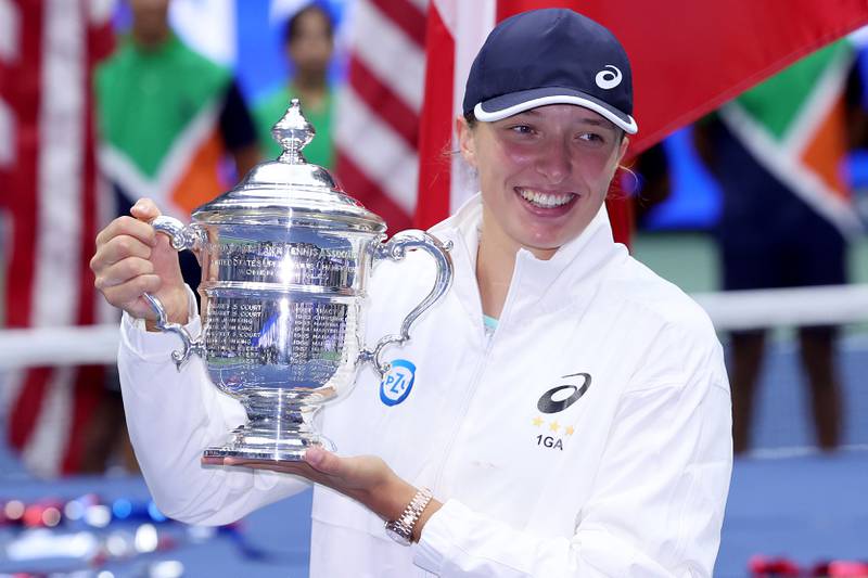 Iga Swiatek with the championship trophy after winning the US Open final. Getty