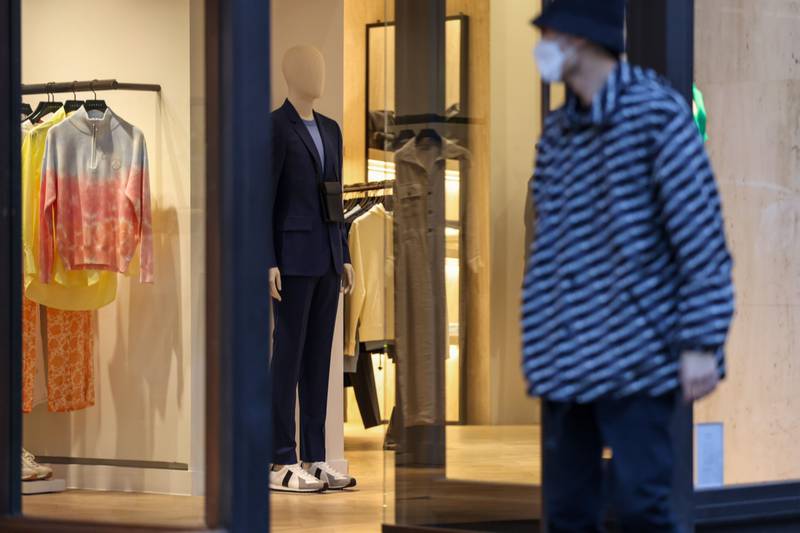 A pedestrian passes a clothing store on Regent Street in central London, UK, on March 24. Bloomberg