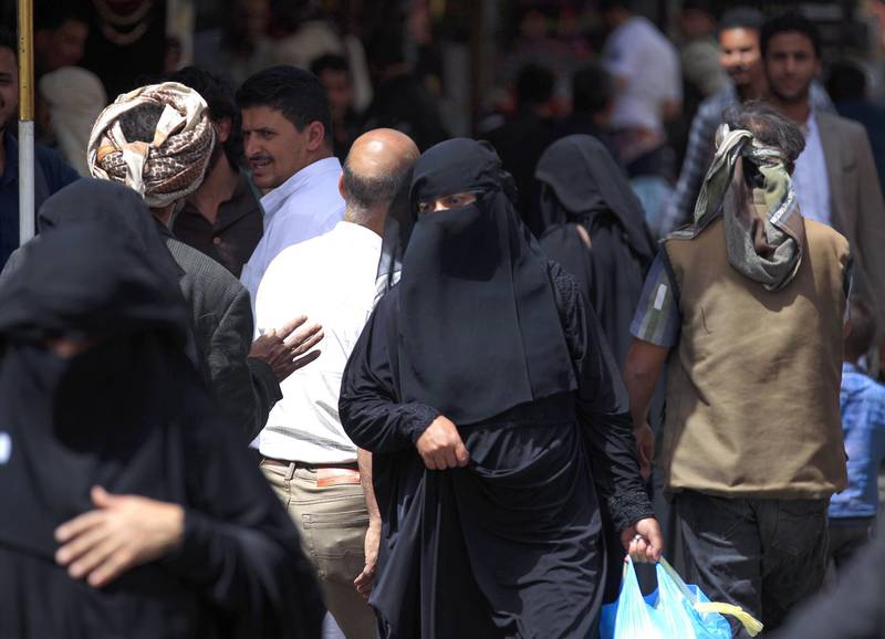 Yemeni women shop in the market in Sanaa where Houthi rebels are imposing strict rules on dress and gender segregation. AFP