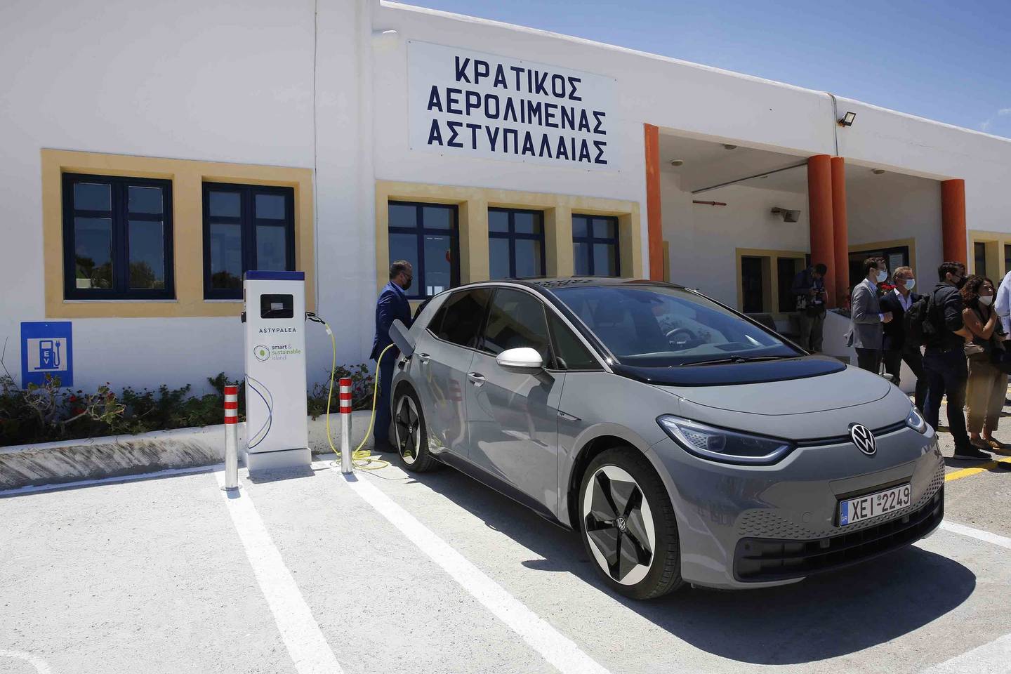 A Volkswagen ID. 4 electric car is charged at the airport of the Aegean Sea island of Astypalea, Greece. AP