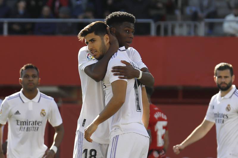 Real Madrid's Aurelien Tchouameni consoles Marco Asensio after he missed a penalty. AP