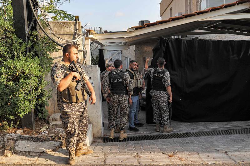 Lebanese security forces at an unoccupied house belonging to central bank chief Riad Salameh last Wednesday. AFP