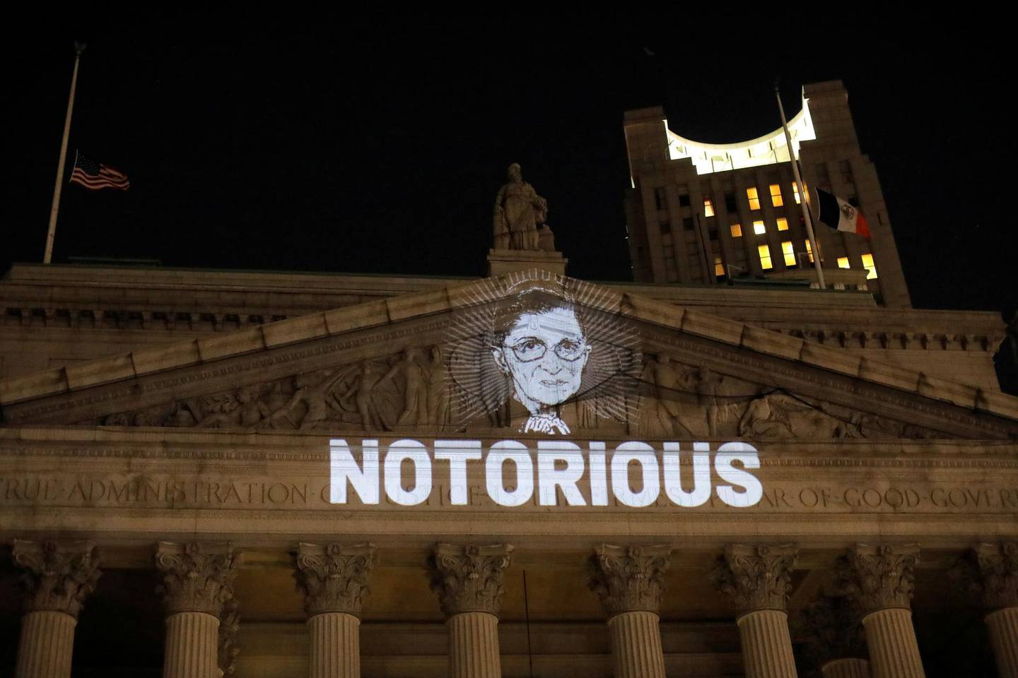 An image of Associate Justice of the Supreme Court of the United States Ruth Bader Ginsburg is projected onto the New York State Civil Supreme Court building in Manhattan, New York City, U.S. after she passed away September 18, 2020. REUTERS/Andrew Kelly