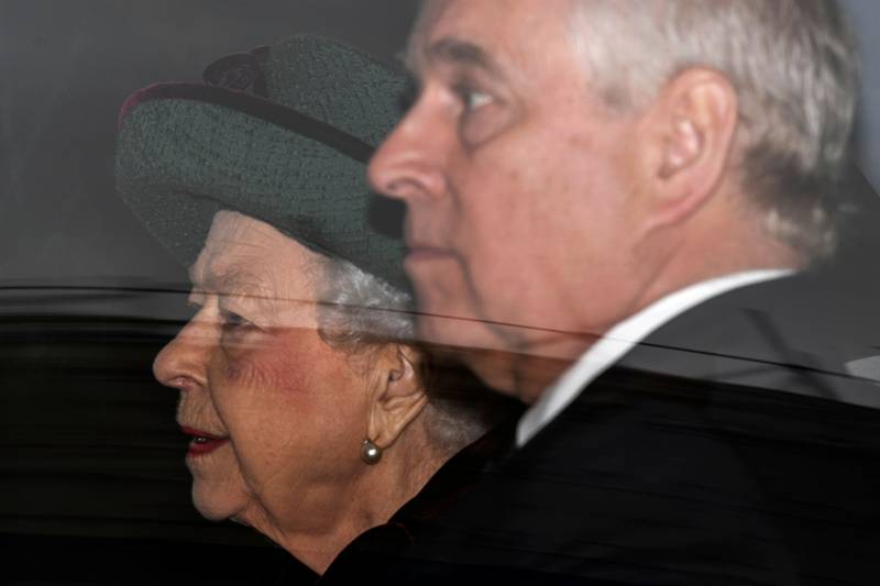 The queen and Prince Andrew leave Westminster Abbey by car. AFP