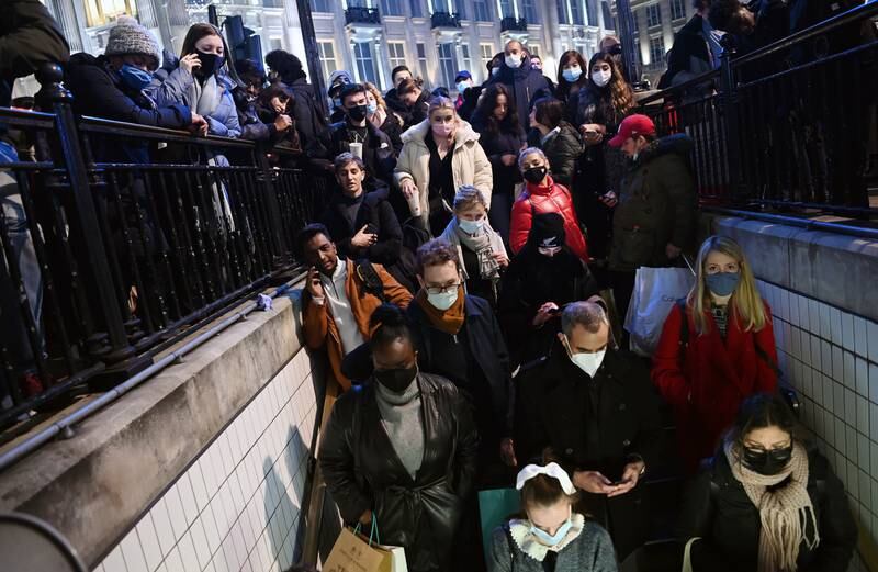 Commuters wait for Oxford Circus station to open in London. EPA