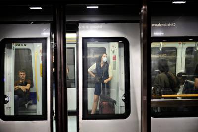 Commuters keep social distancing inside an underground train in Copenhagen, Denmark. EPA