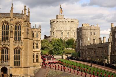 The procession, led by the dismounted detachment of the Household Cavalry, followed by massed Pipes and Drums of Scottish and Irish regiments, the Brigade of Gurkhas, the Royal Air Force and the Band of the Grenadier Guards, arrives at Windsor Castle. Getty Images
