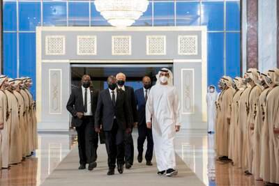 Philip Mpango, Vice President of Tanzania, walks with Sheikh Shakhbut bin Nahyan, Minister of State, at the Presidential Airport.