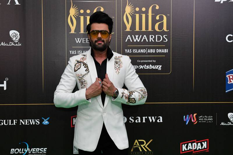 Manish Paul, in an embellished white blazer with a black shirt. AFP 
