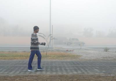 Abu Dhabi, United Arab Emirates, December 30, 2019.  A morning fitness buff takes a walk on a foggy morning at Khalifa City, Abu Dhabi.Victor Besa / The NationalSection:   NA Reporter: