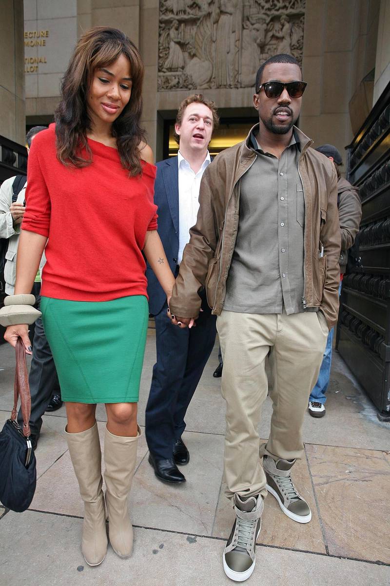 PARIS - OCTOBER 4:  Hip-Hop producer Kanye West and girlfriend Alexis Phifer arrive for the Stella Mc Cartney fashion show during the Sping/ Summer 08 fashion week on October 4, 2007 in Paris, France. (Photo by Julien Hekimian /Getty Images)