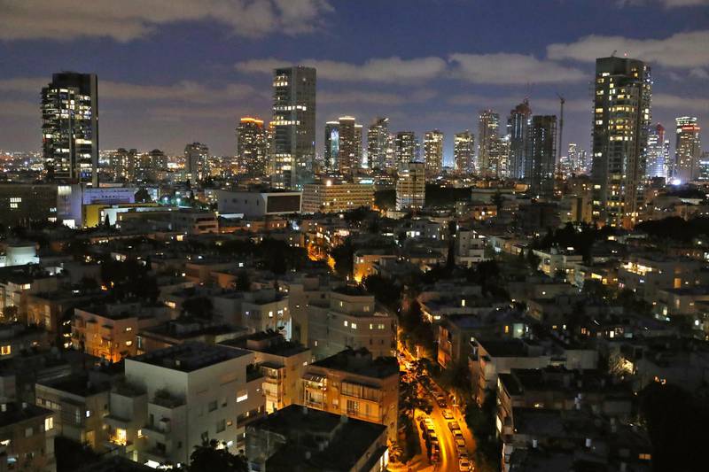 This picture taken on June 23, 2020 shows a general view of the skyline of buildings in Israel's Mediterranean coastal city of Tel Aviv in the early evening. (Photo by JACK GUEZ / AFP)