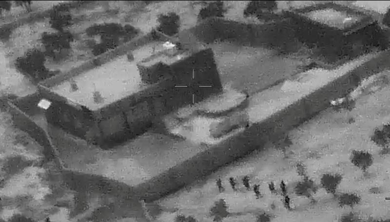US special forces move towards the compound of Islamic State leader Abu Bakr Al Baghdadi during a raid in the Idlib region of Syria in a still image from video. Reuters