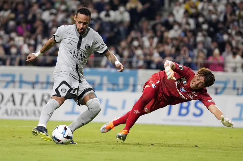 PSG's Neymar scores his second goal past Gamba Osaka goalkeeper Masaaki Higashiguchi. AP