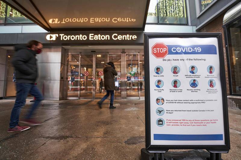 (FILES) In this file photo people arrive at the entrance to the Toronto Eaton Centre in downtown Toronto, Ontario on November 23, 2020, the first day of a new lockdown in the city.  Ontario Premier Doug Ford announced on April 1, 2021 strict measures for all of April in Canada's most populous province to slow a surge in Covid-19 cases, but stopped short of a total lockdown.The shutdown of most stores and severe limits on services in the province of 14 million people is to start on Saturday and last for at least 28 days. "Ontario is pulling the emergency brake for the entire province," Ford told a news conference. / AFP / Geoff Robins
