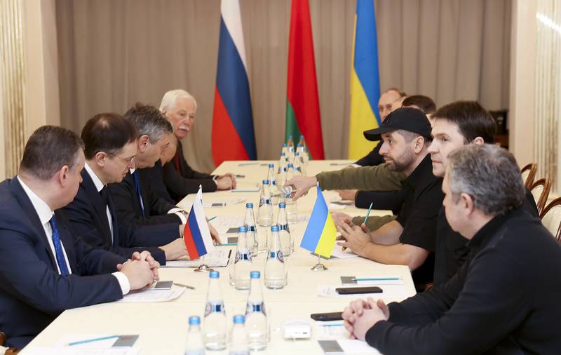 Vladimir Medinsky, the head of the Russian delegation, second left, and Davyd Arakhamia, faction leader of the Servant of the People party in the Ukrainian Parliament, third right, attend the peace talks in the Gomel region of Belarus. AP