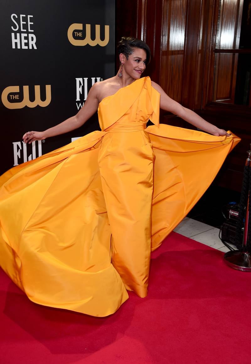 Ariana DeBose attends in an orange Carolina Herrera dress. Getty Images