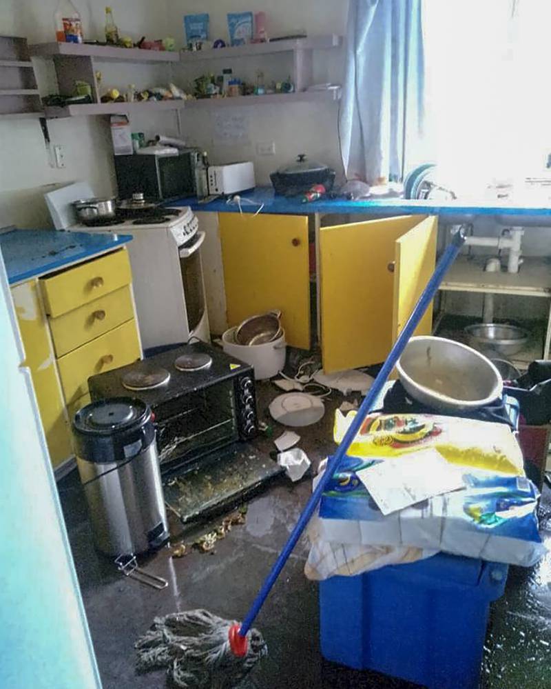 Debris lies strewn across the floor in the kitchen of Renagi Ravu's house in the town of Kainantu, following the quake.